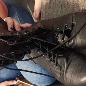 Black lace up combat boot some wear